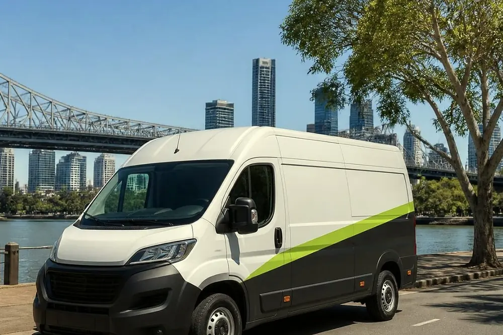 White Laser Printers service van parked on a Brisbane city street beside an office building
