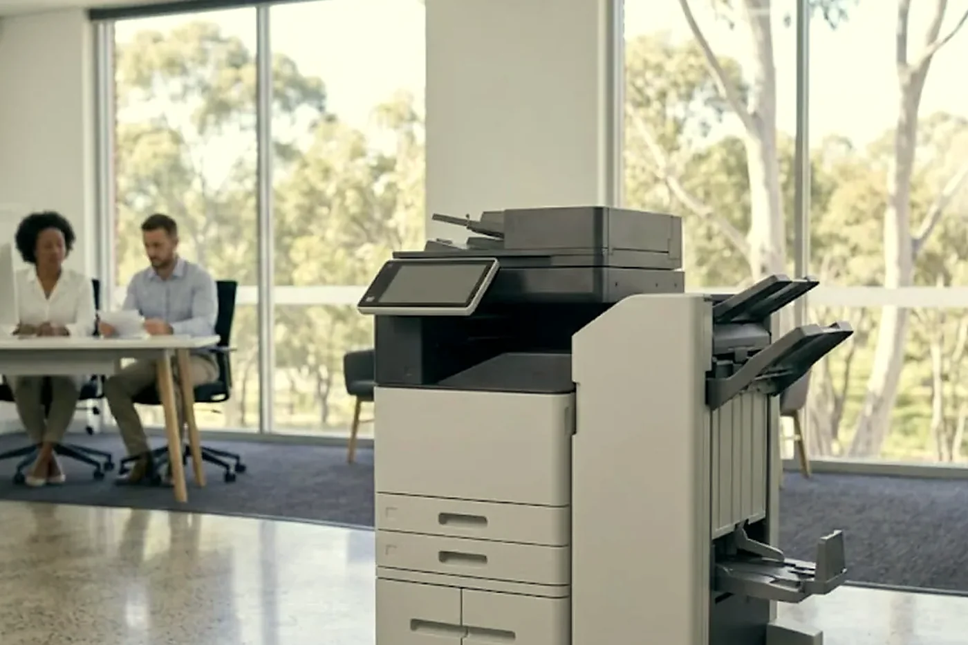 Floor standing copier with finisher in a bright open plan Brisbane office